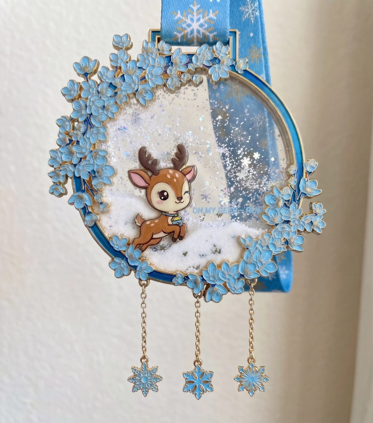 Blue sakura liquid glitter deer medal with three snowflake charms